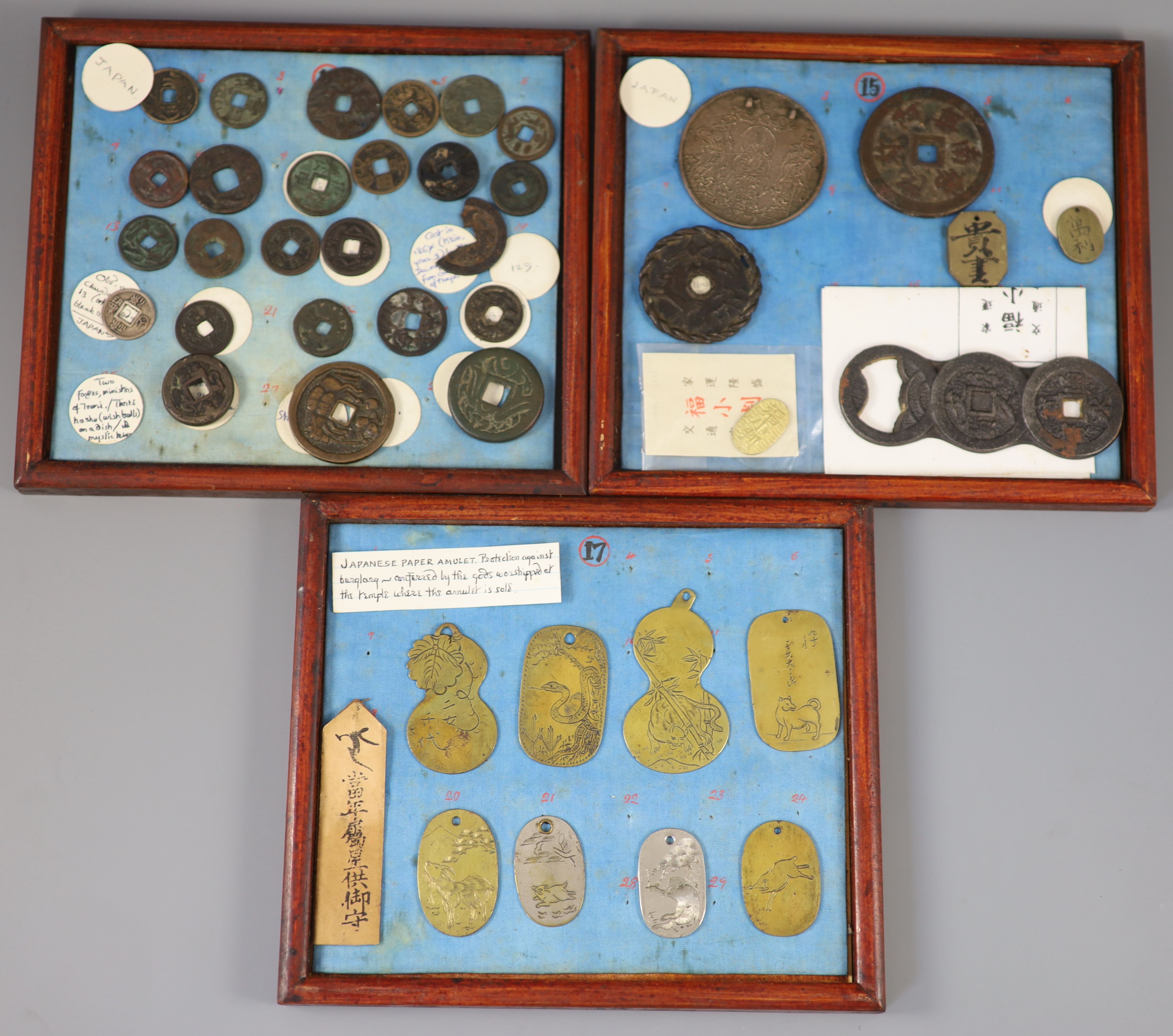 A group of 40 Japanese bronze and metal amulets or charms, 19th/20th century,